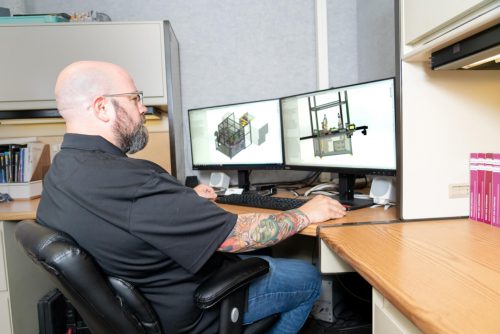 New Concept Technology engineer working at a desk