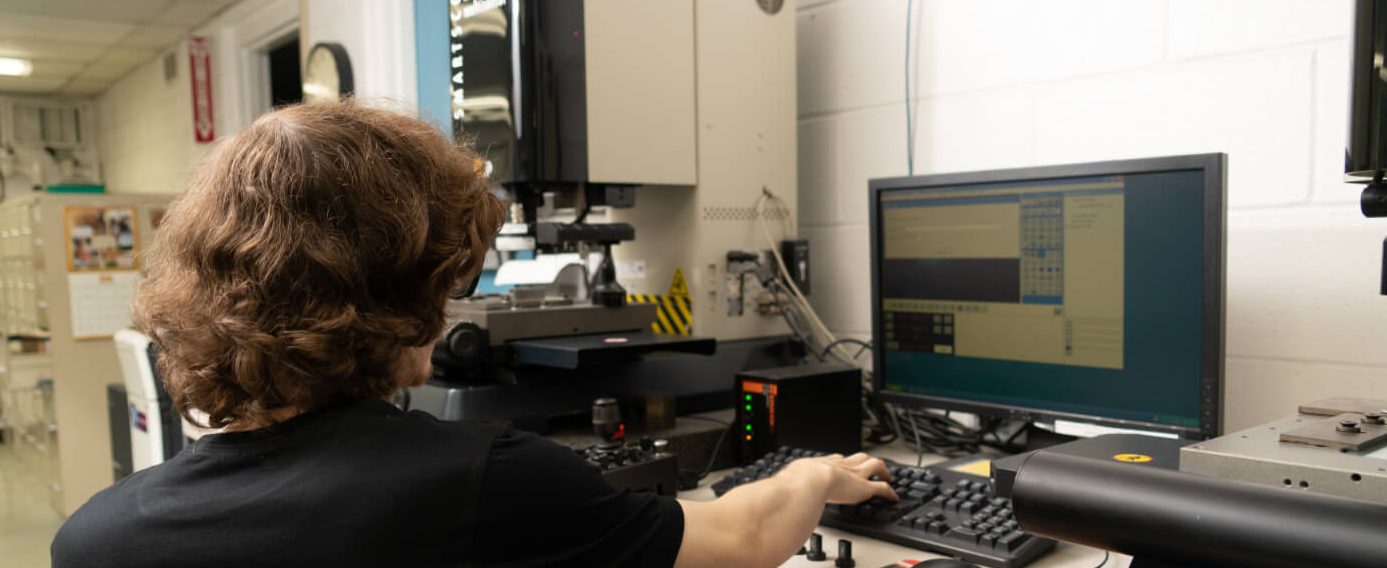 NCT employee performing a quality inspection