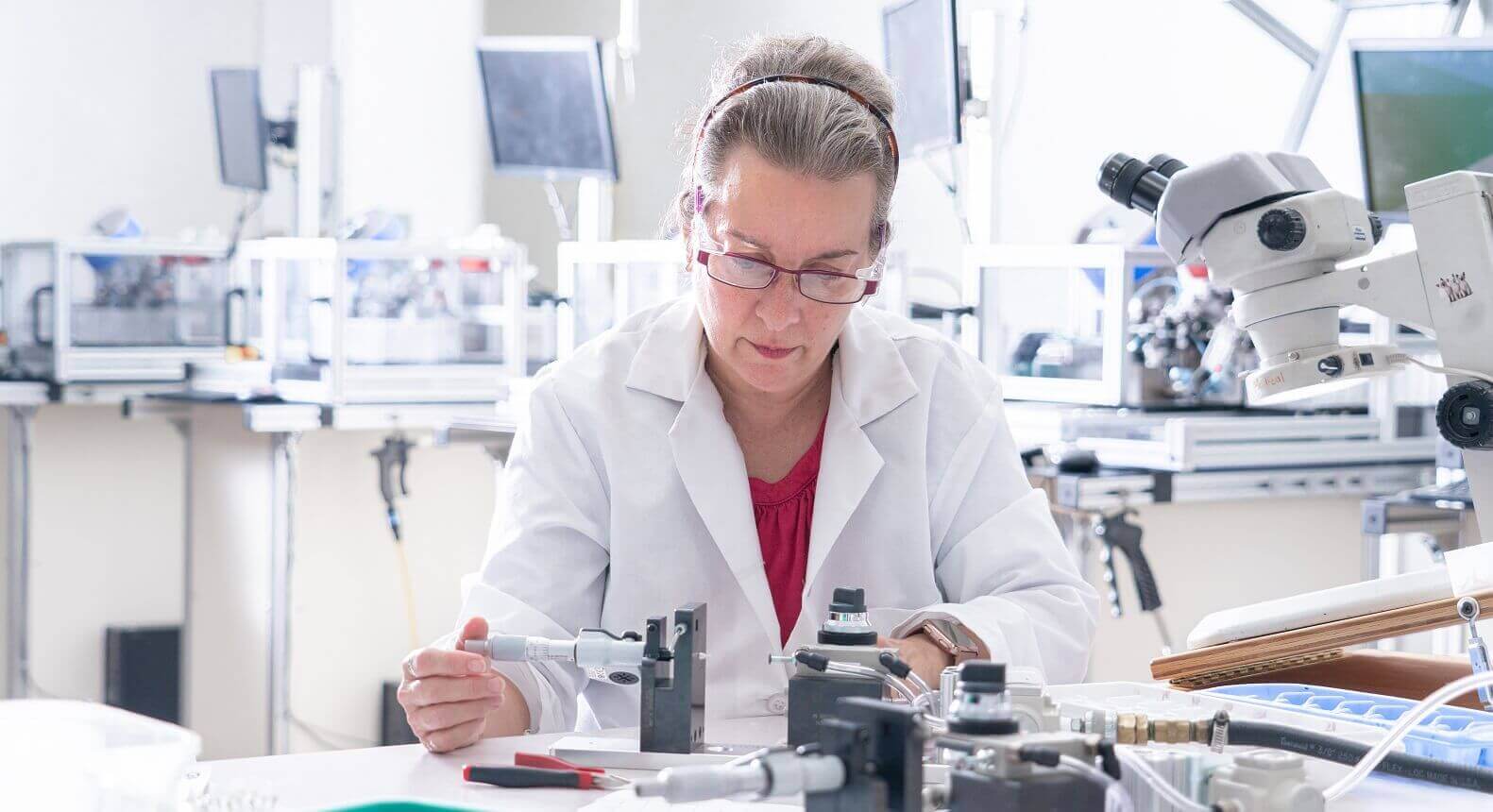 Medical professional working with a machine